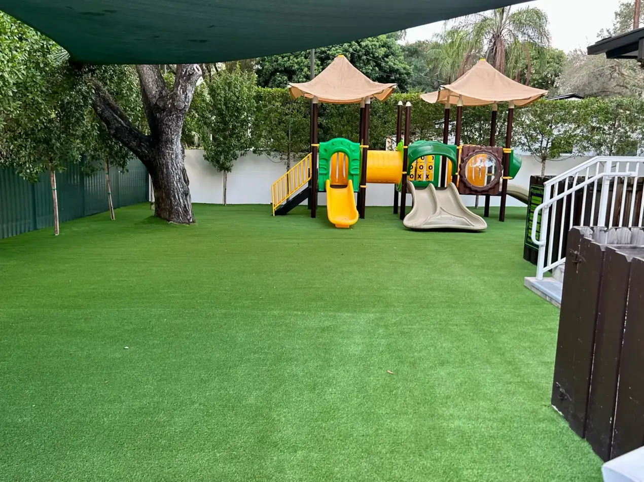 Playground turf installation with fall-attenuation shock pad