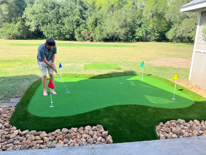 Custom backyard putting green installed by First Class Turf Houston